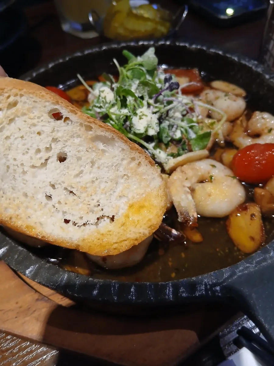Baguette and shrimp dipped in gambas oil