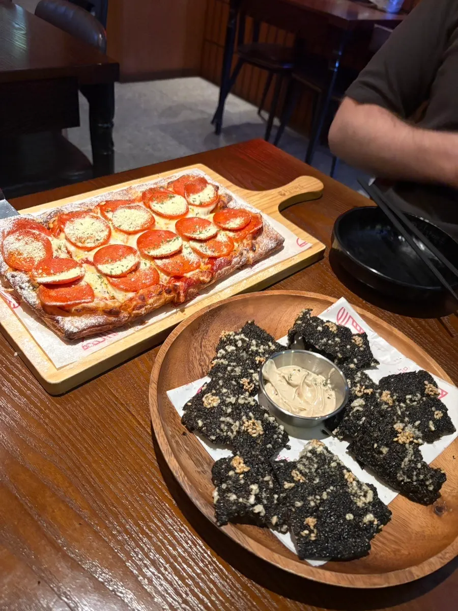 A whole handmade pastry-dough pepperoni pizza