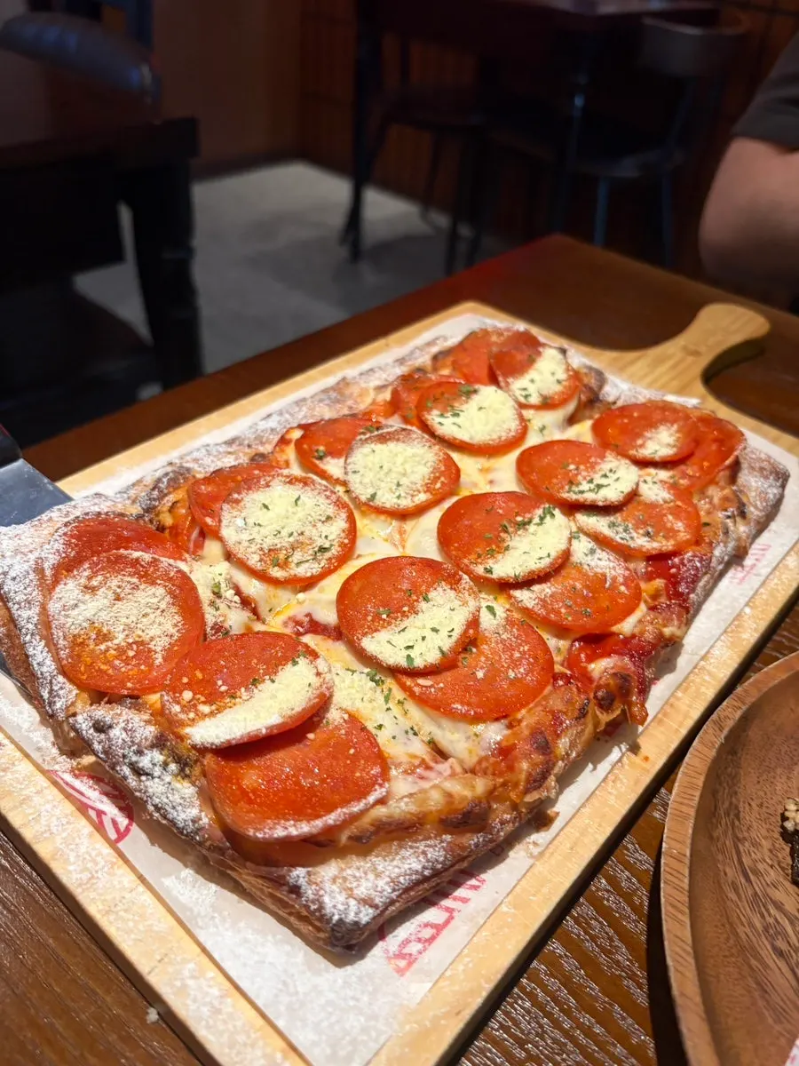 Cross-section of the layered pastry pizza crust