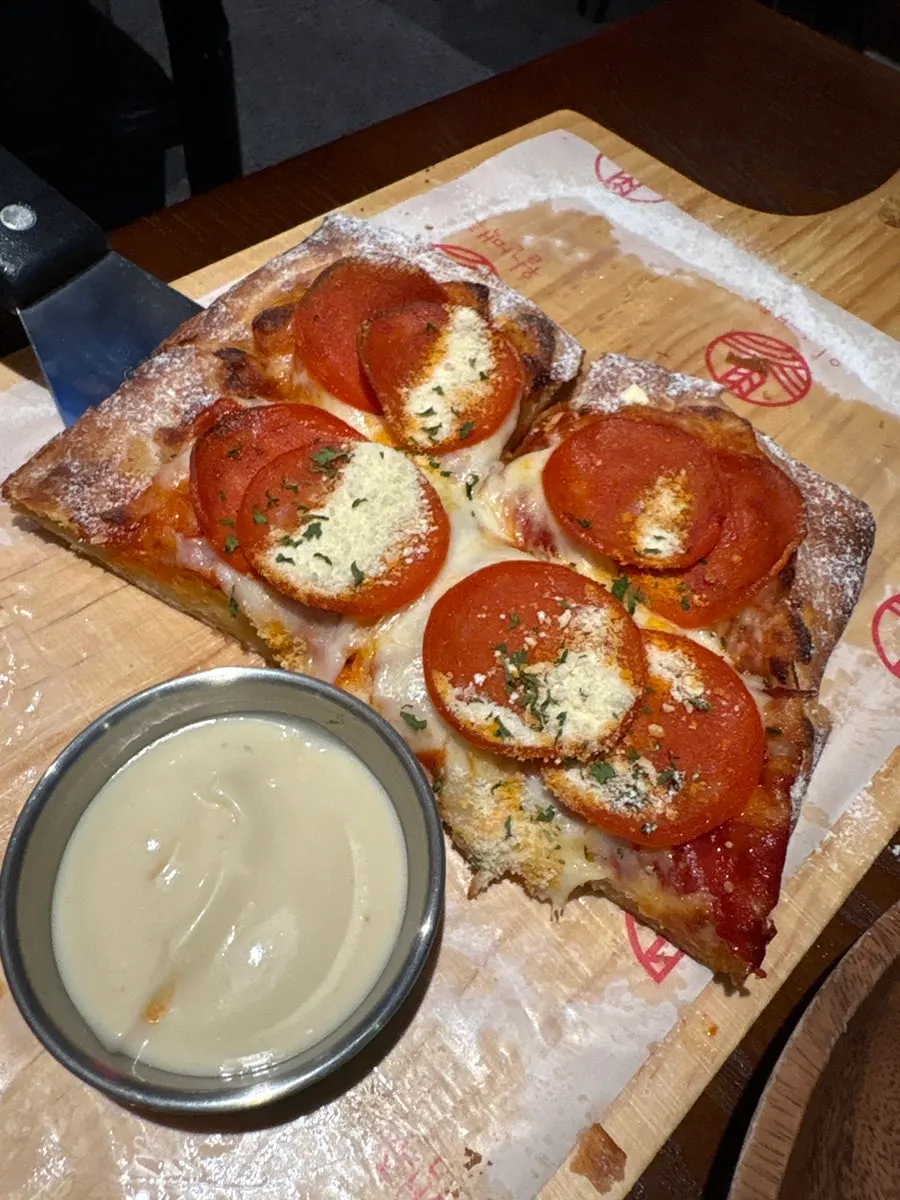Pizza table set with beer
