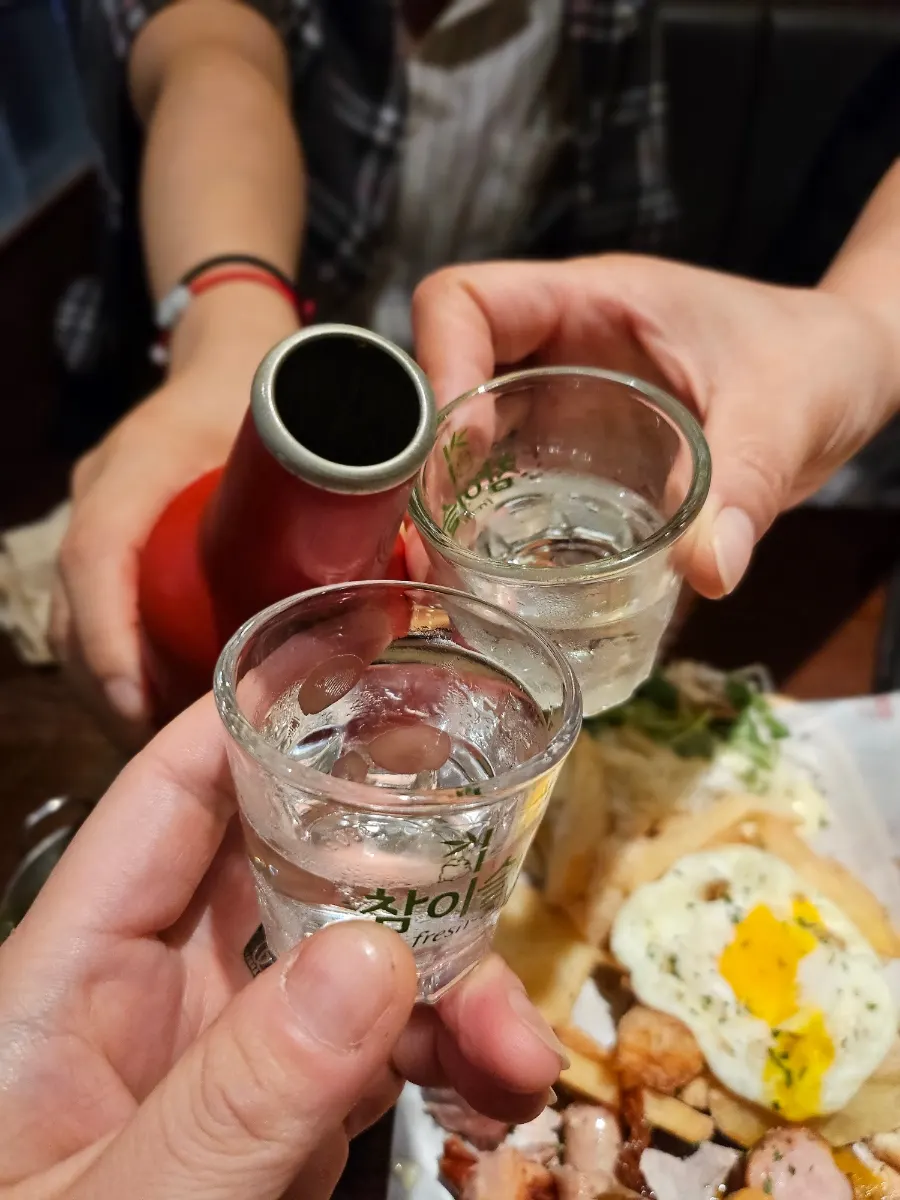 A glass of imported beer alongside the side dishes
