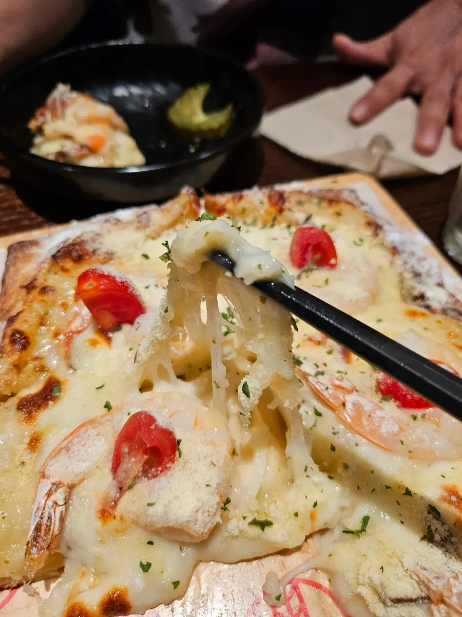 Full view of the honey garlic shrimp pizza on pastry dough