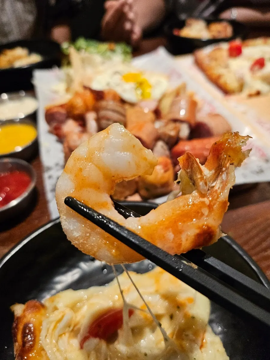 Close-up of plump shrimp on the pizza