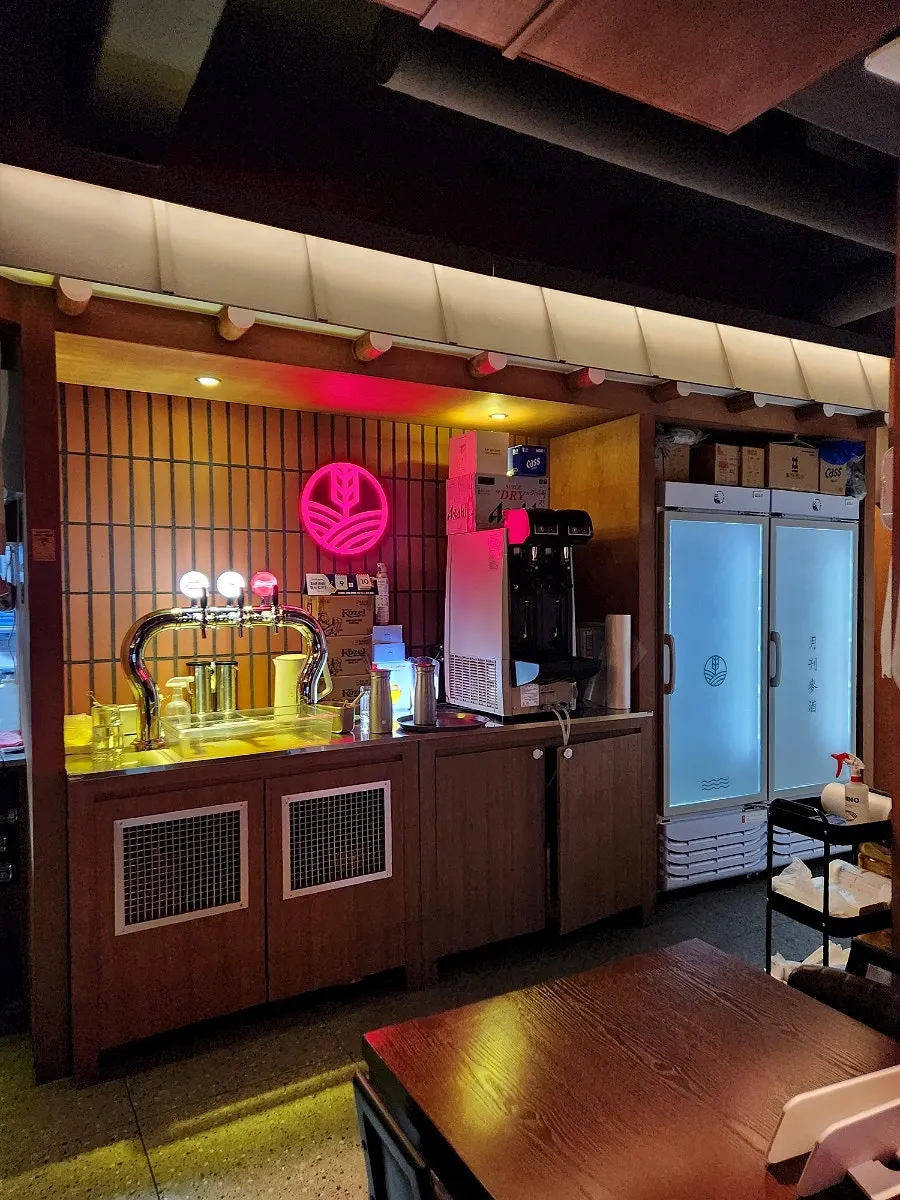 Draft beer bar and kitchen at the front of Monthly Beer