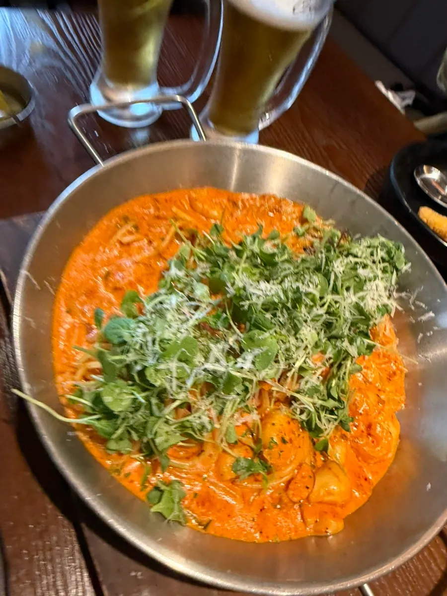 A plate of shrimp jjamppong cream pasta at Monthly Beer