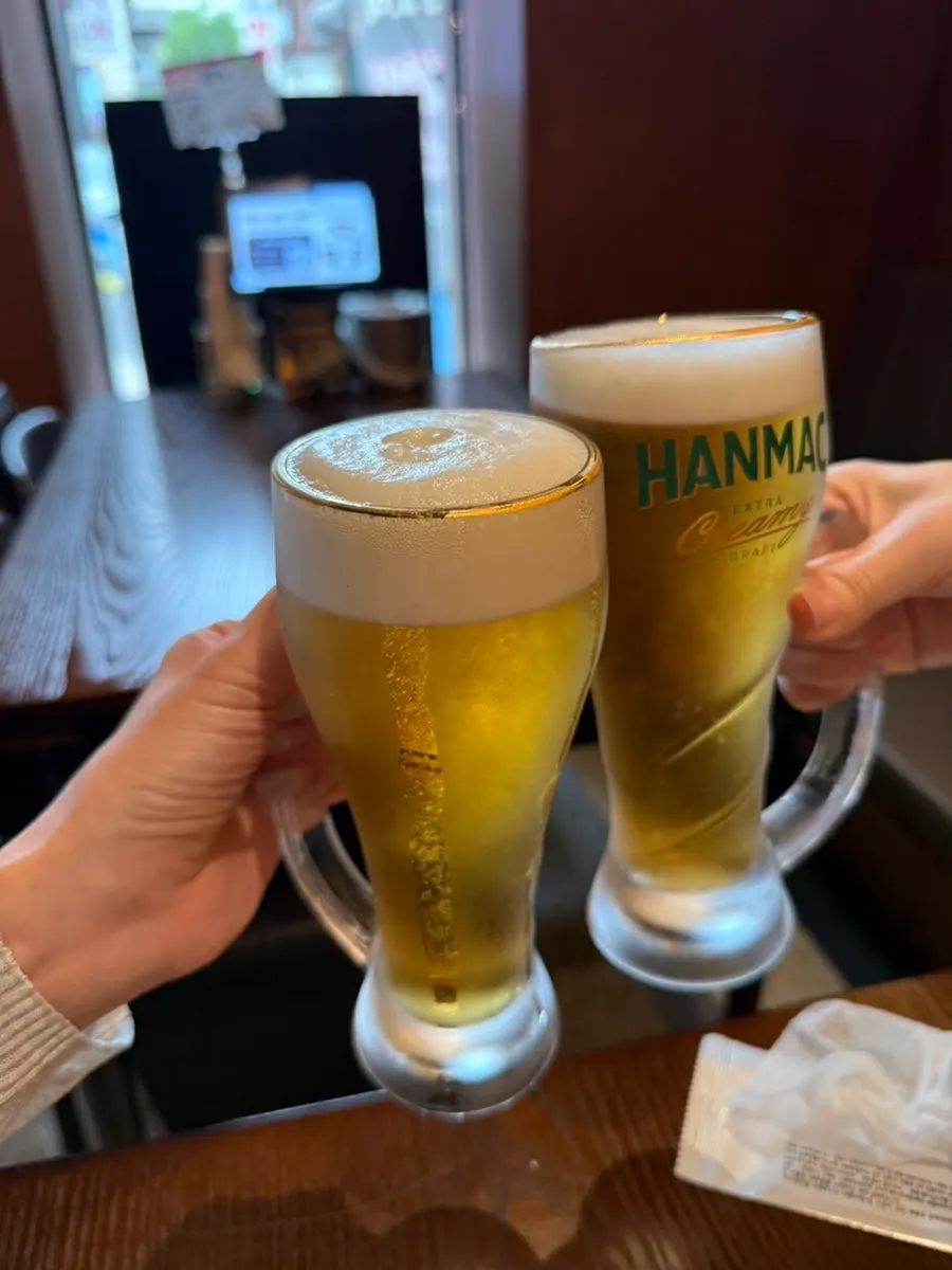 Two frothy glasses of cold draft beer