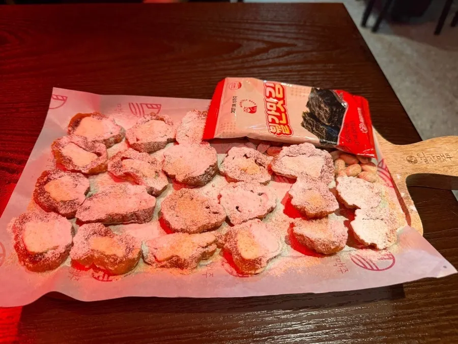 Plate of cream cheese-stuffed dried persimmon rolls with seaweed