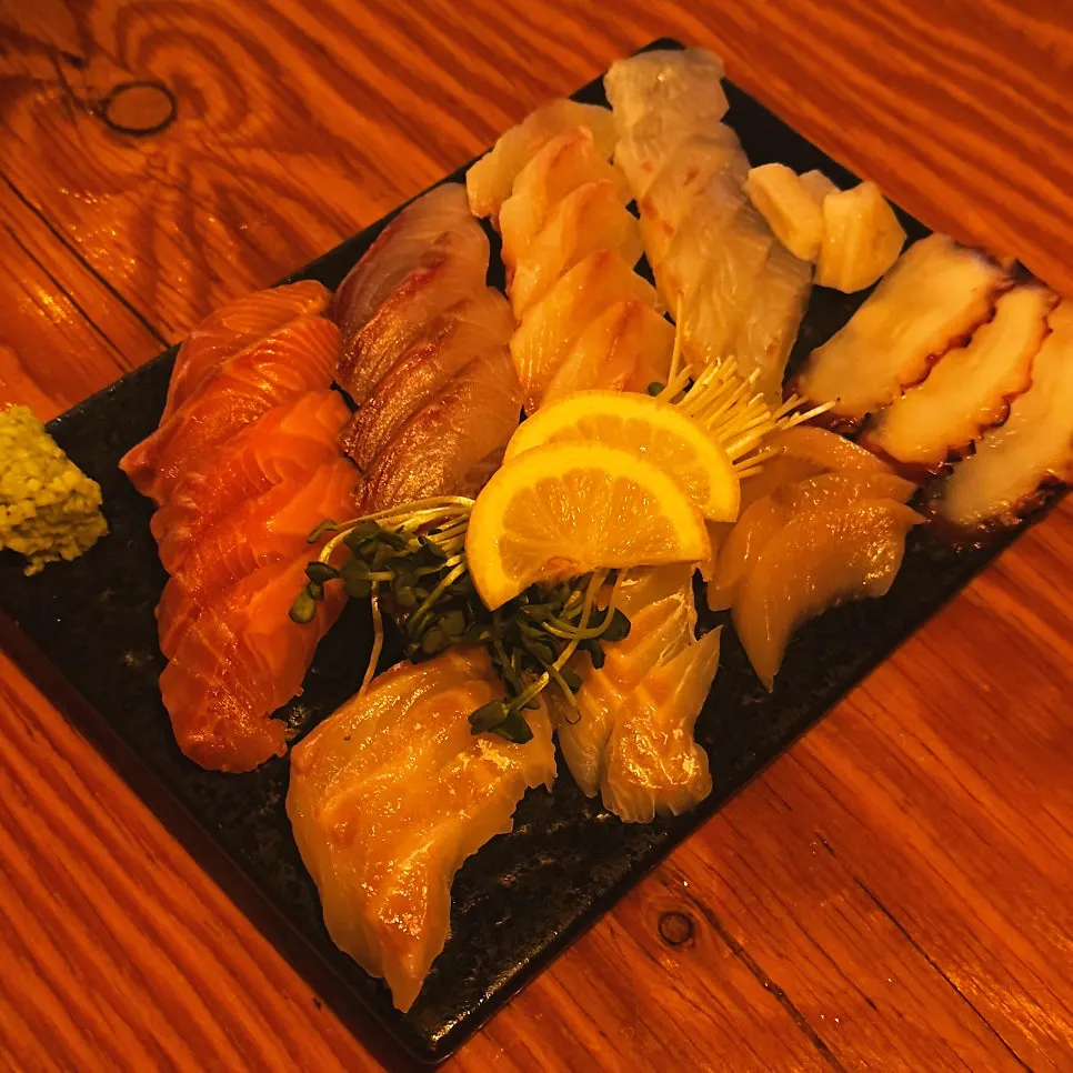 Mixed sashimi platter with salmon, flounder, and boiled octopus