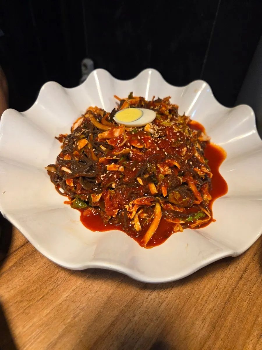 Bite-size cold jokbal served with cheonsachae noodles