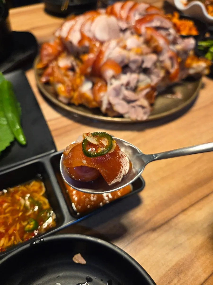 Front leg jokbal with a shot glass of soju