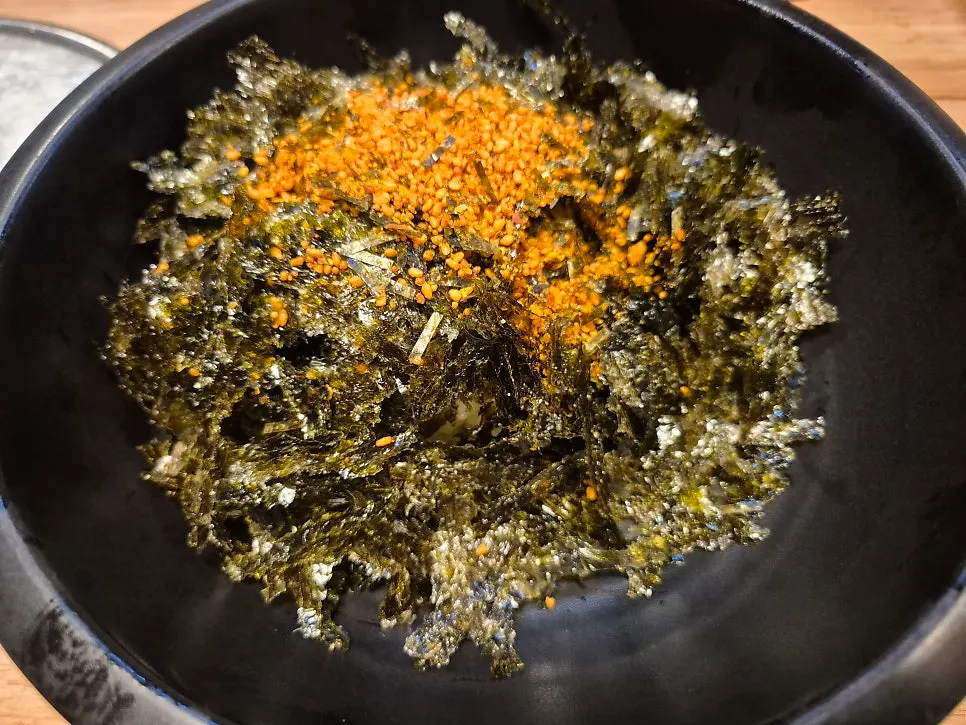 Cold bean sprout soup served with spicy jokbal