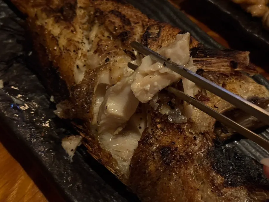 Grilled fish served with lemon and wasabi