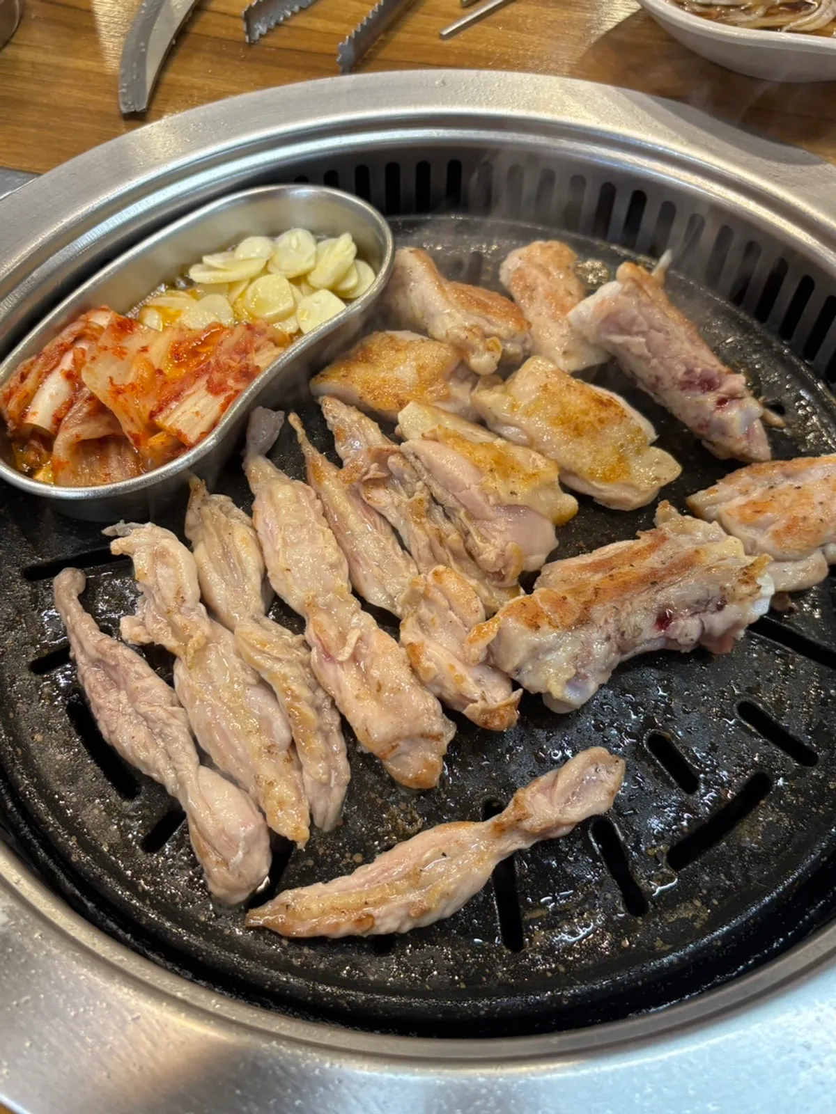 Salt dakgalbi and chicken neck meat on the grill