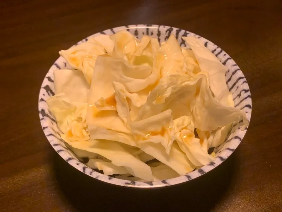 A refilled plate of cabbage salad