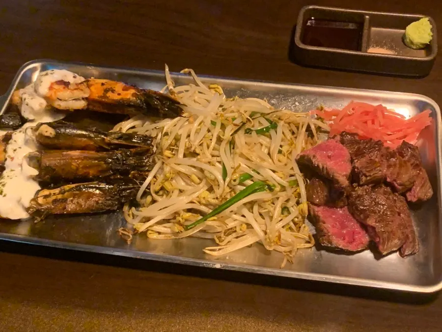 Wagyu, bean sprouts, and black tiger shrimp grilled on the teppan