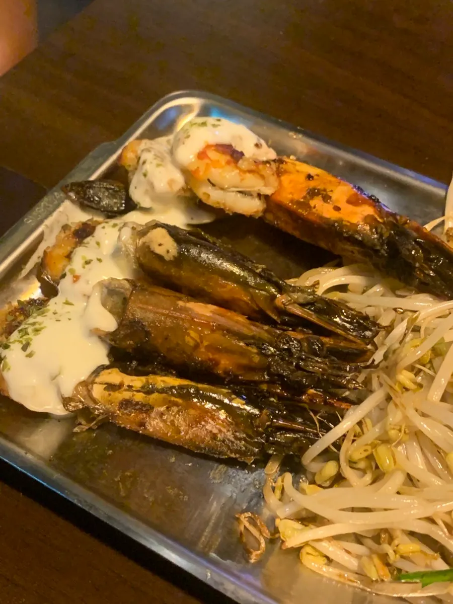 Black tiger shrimp grilling on the teppan