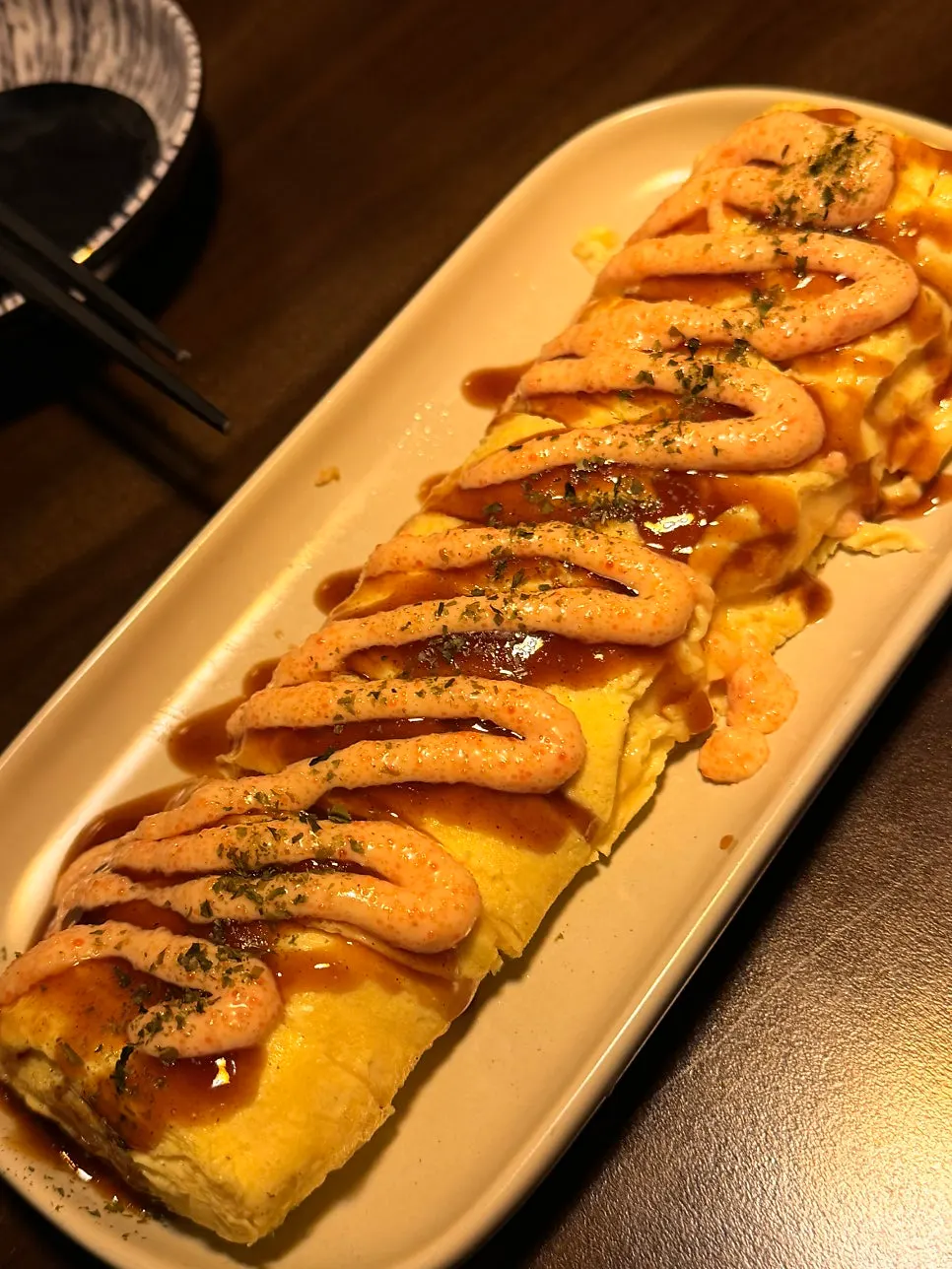 A plate of mentaiko cheese rolled omelette