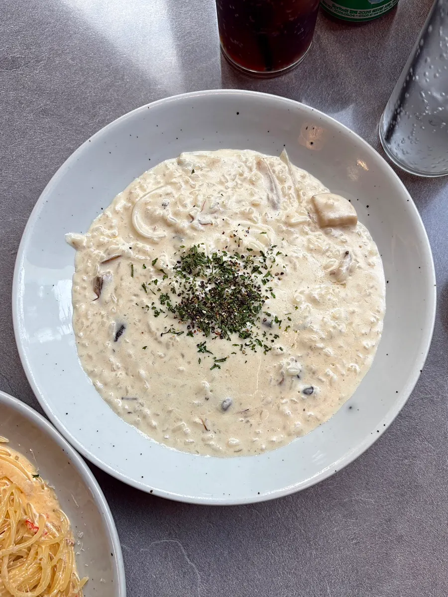Cream risotto topped with mushrooms