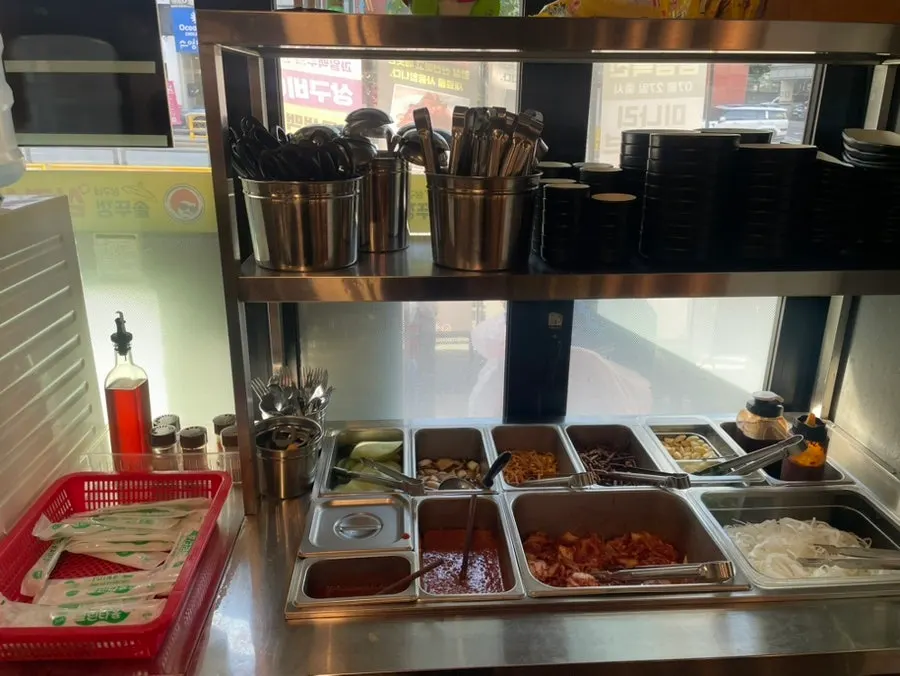 Self-serve bar with kimchi and side dishes