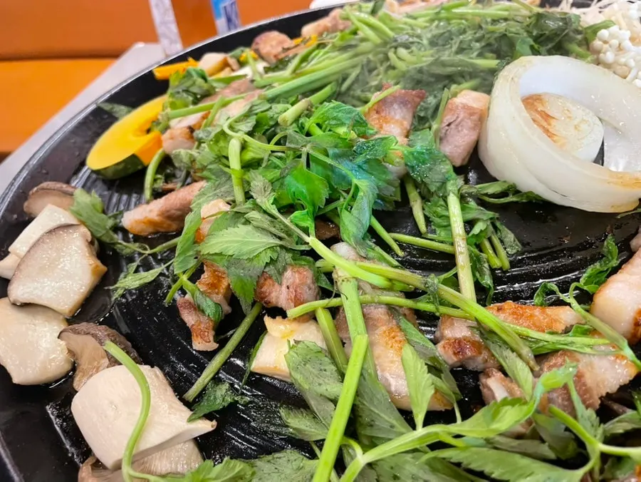 Grilled pork belly served with minari