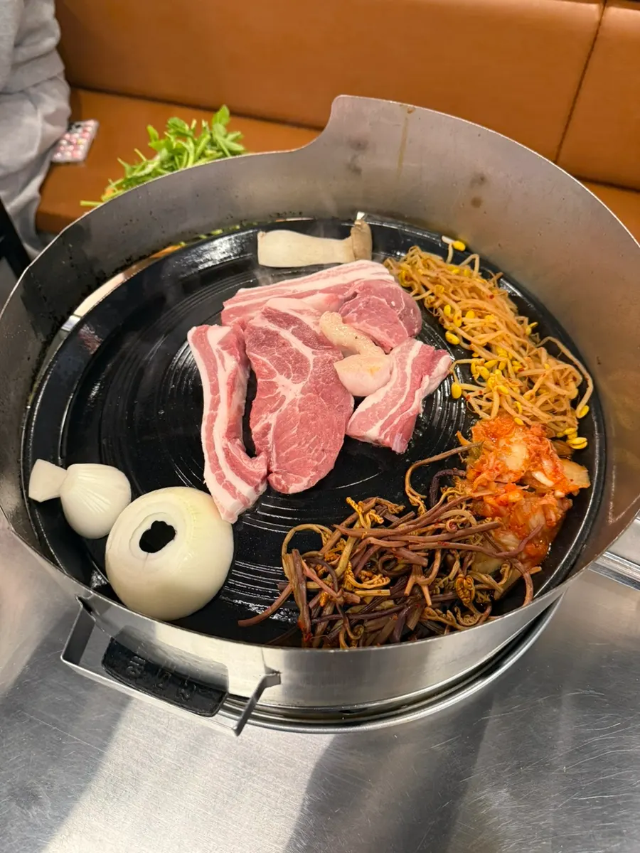 Minari placed over the cooked meat