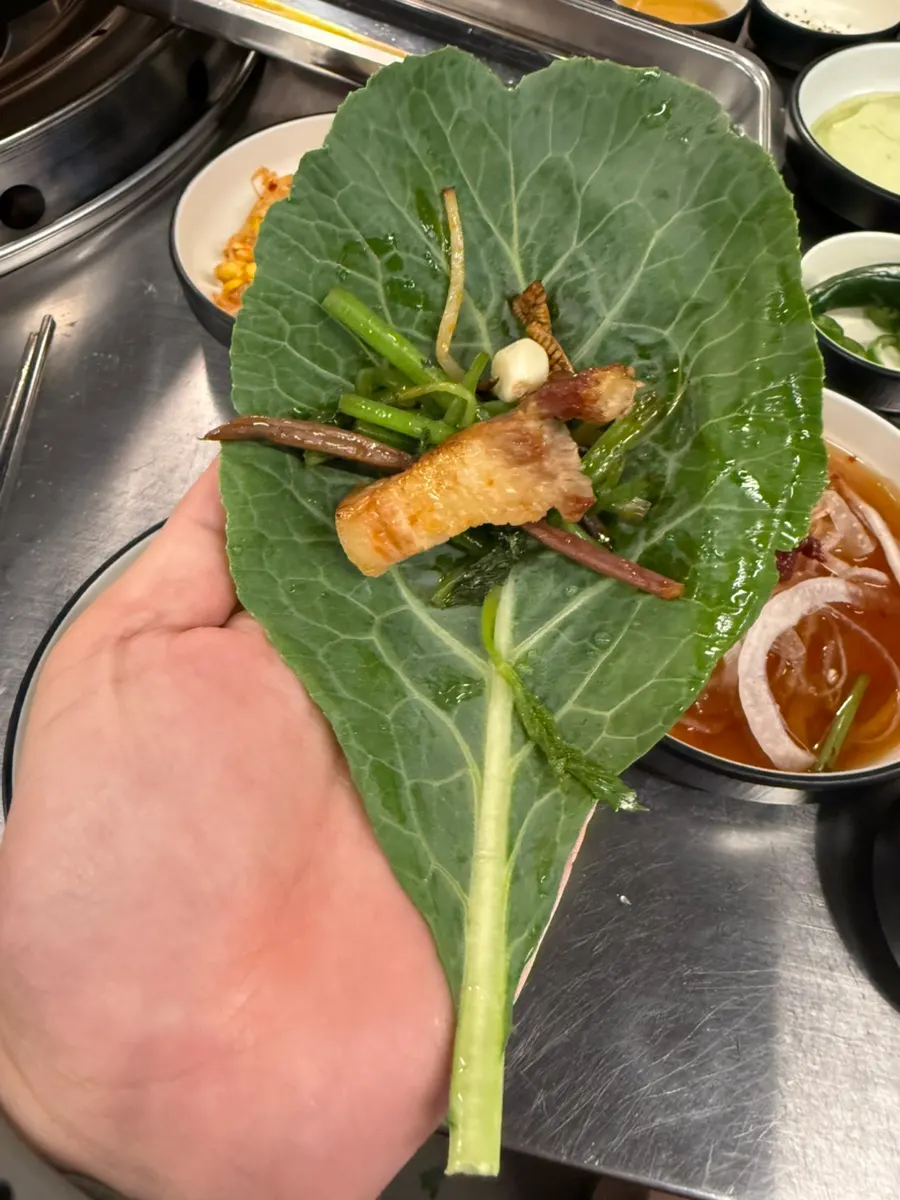 Pot-lid grilled meat finished with minari