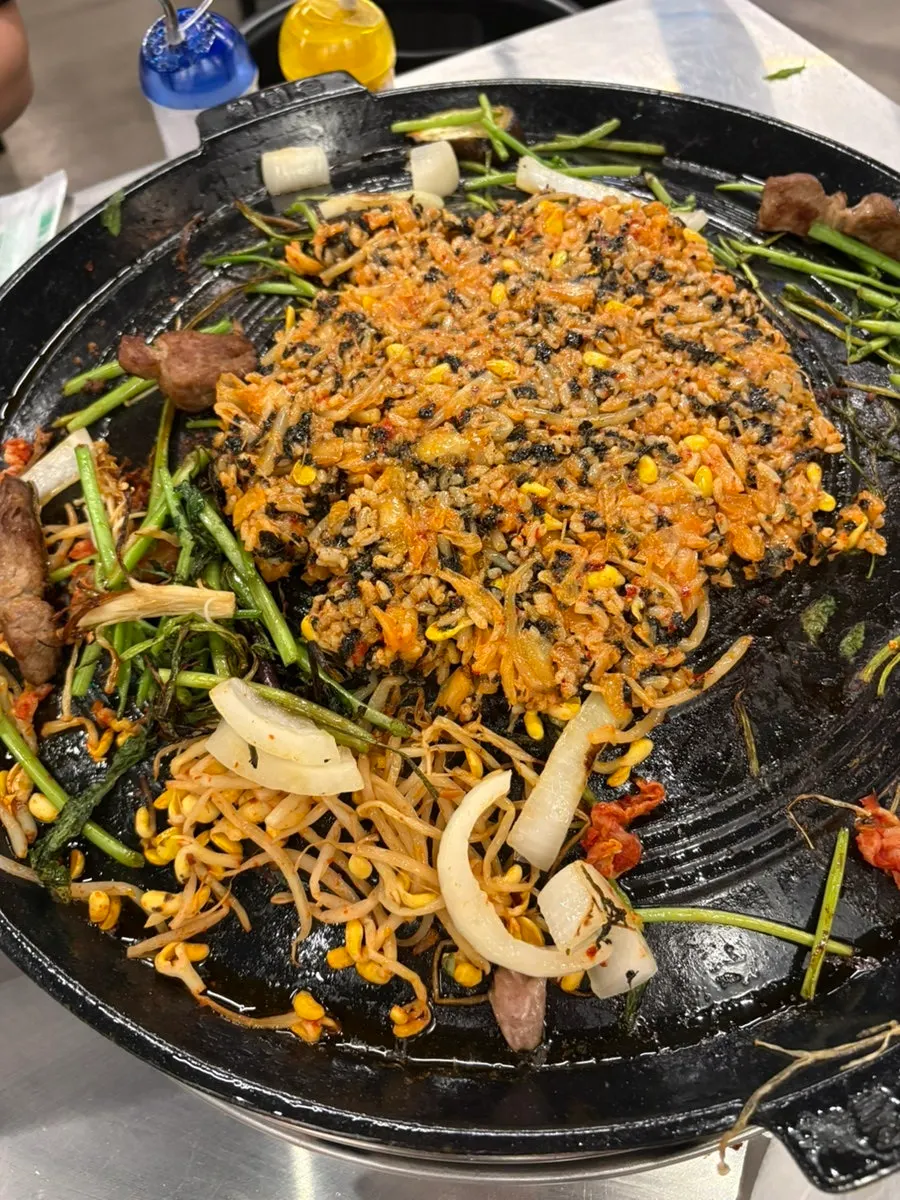 A lettuce wrap loaded with meat and vegetables