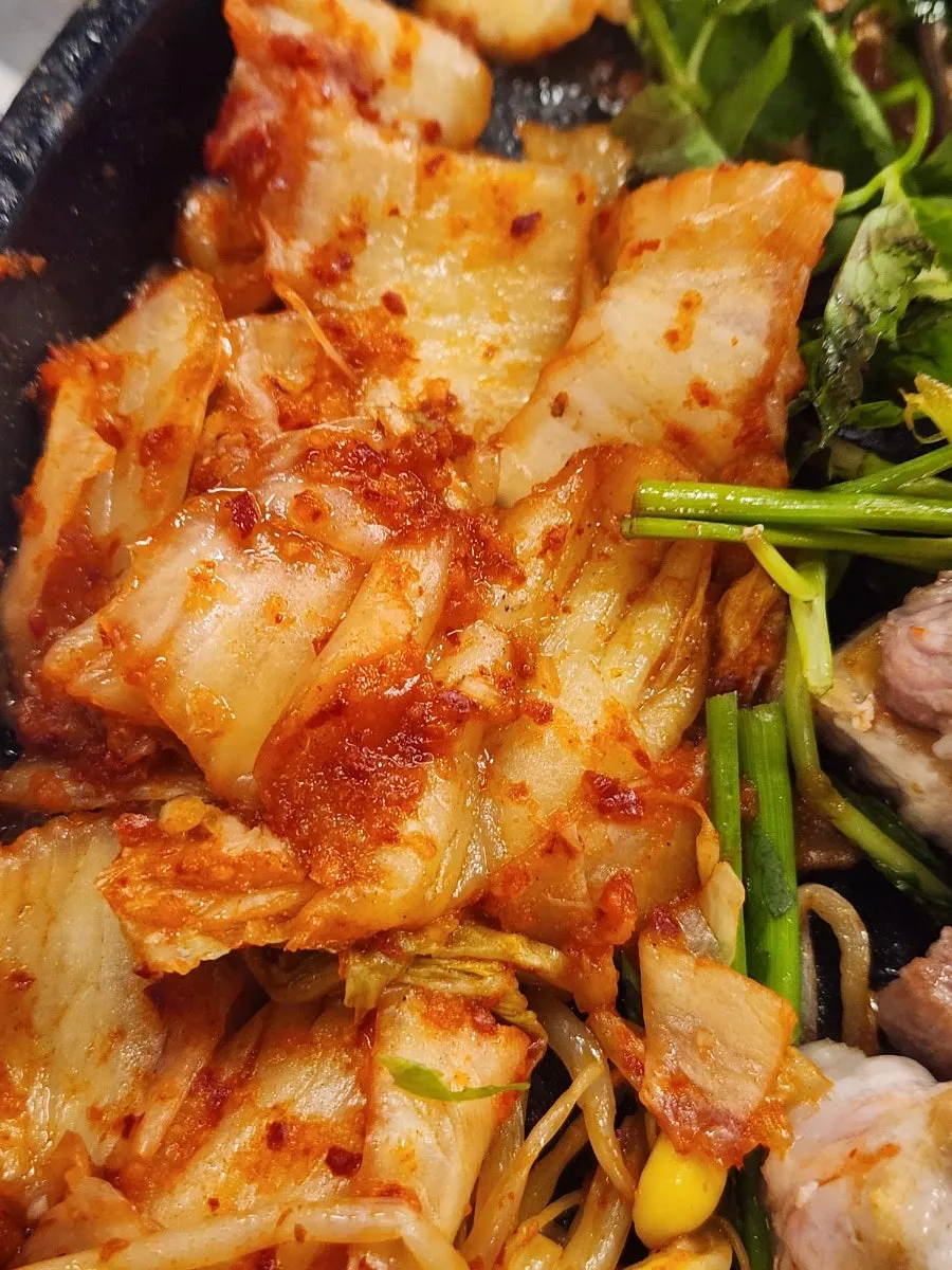 Kimchi and bean sprouts cooked in pork fat