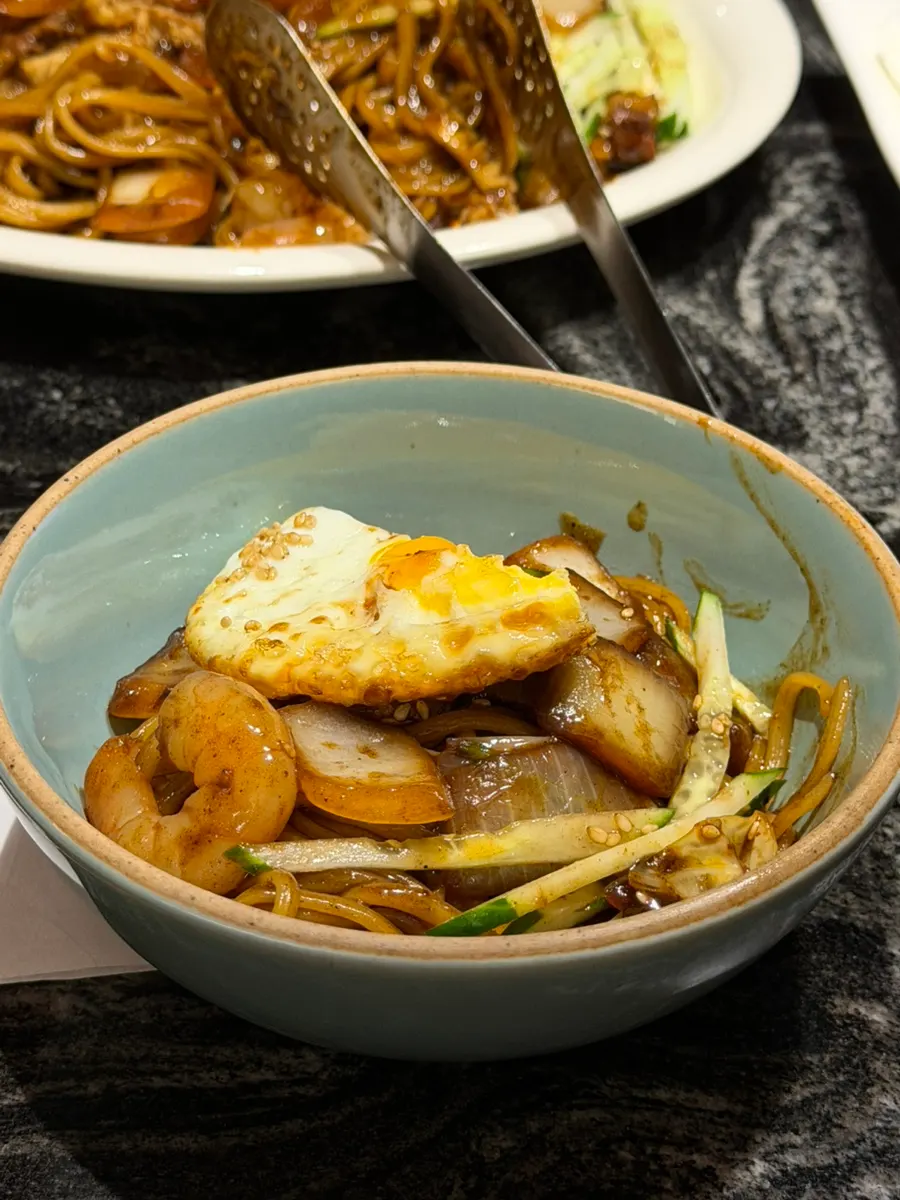 Noodles from the seafood jjajang, well coated in sauce