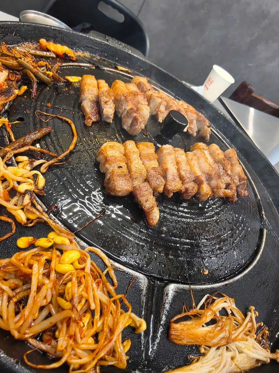 Fully cooked pork belly paired with wrap greens