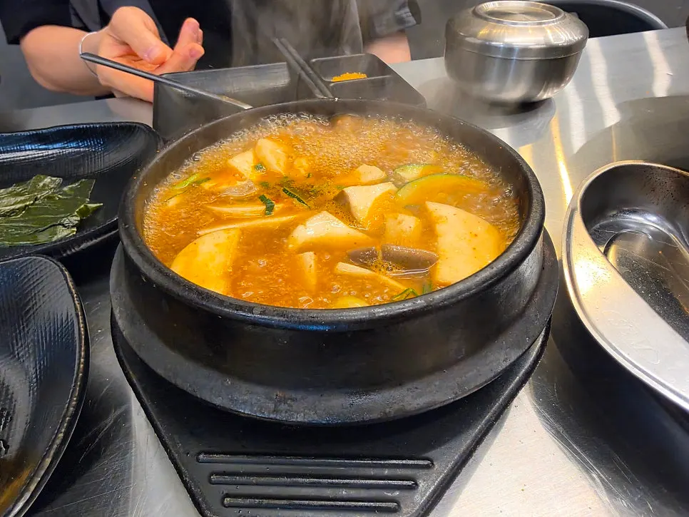 Doenjang jjigae served alongside the pork belly