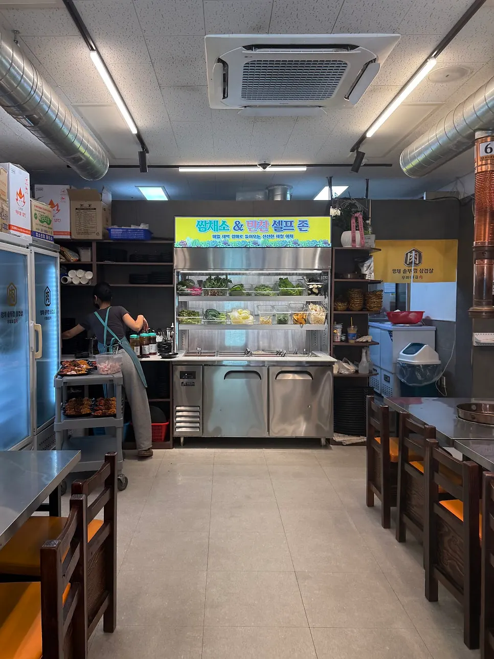 Interior view showing the self-serve zone and tables on either side