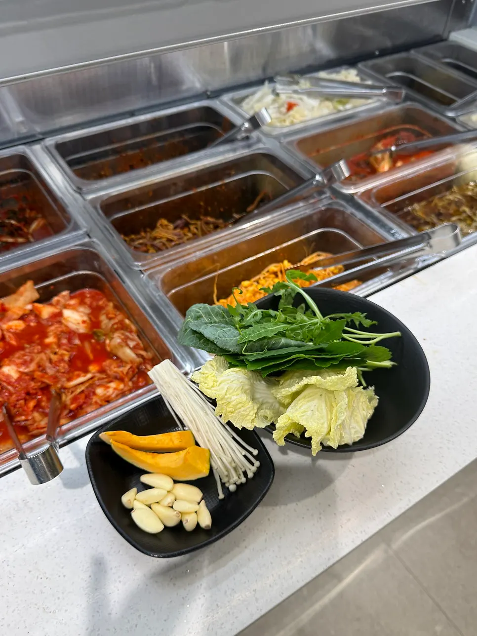 A plate of self-served all-you-can-eat wrap greens