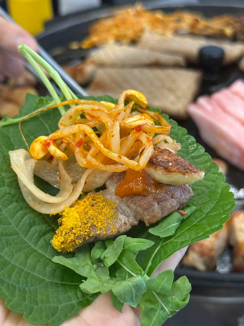 A piece of meat dipped in curry powder