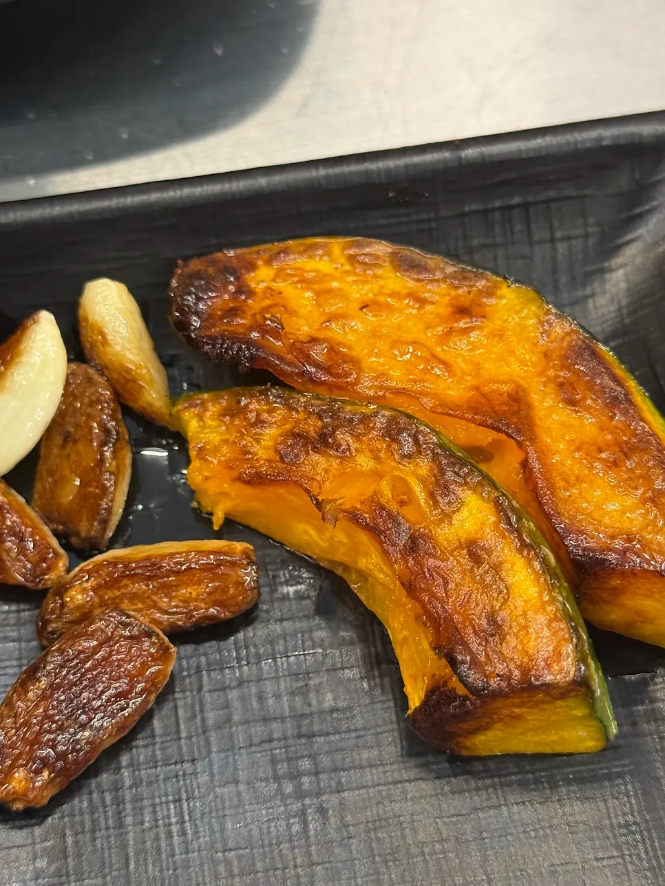 Grillable vegetables cooked together on the iron lid