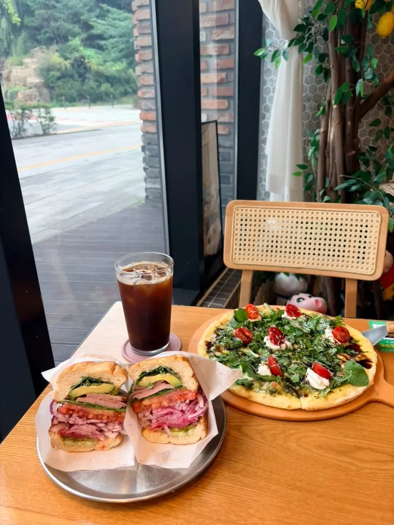 Sandwich and arugula pizza brunch spread