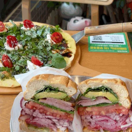 Arugula ricotta cheese pizza and sandwich