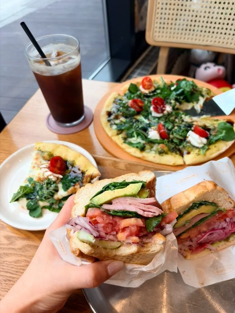 Thick avocado arugula sandwich