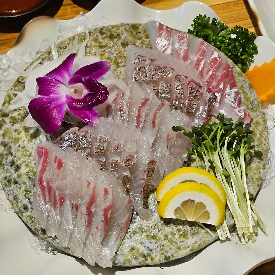 Red sea bream yubiki on a jade stone slab
