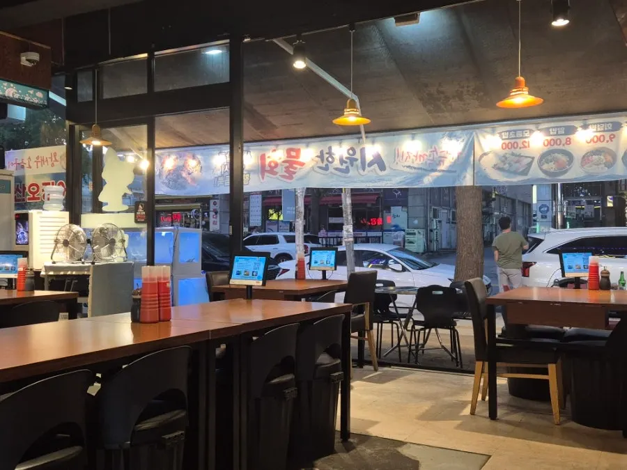 Indoor table seating at the raw fish restaurant
