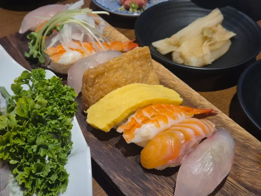 A plate of assorted flounder, salmon, mullet and rockfish sashimi