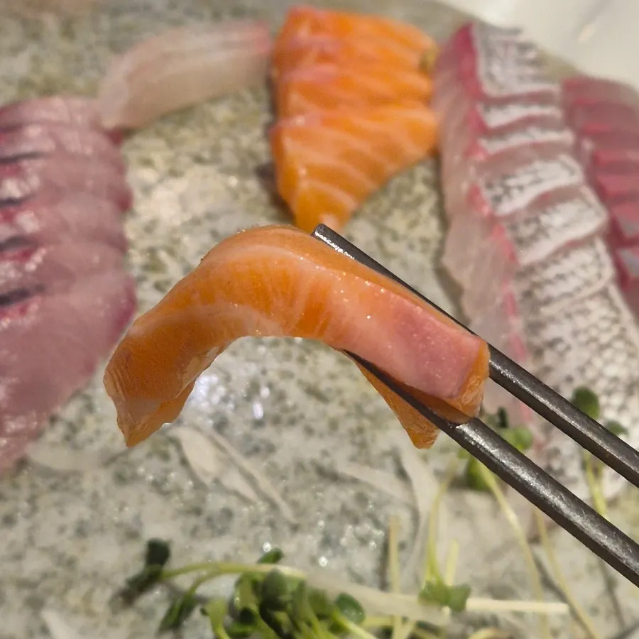 A glass of soju paired with the sashimi