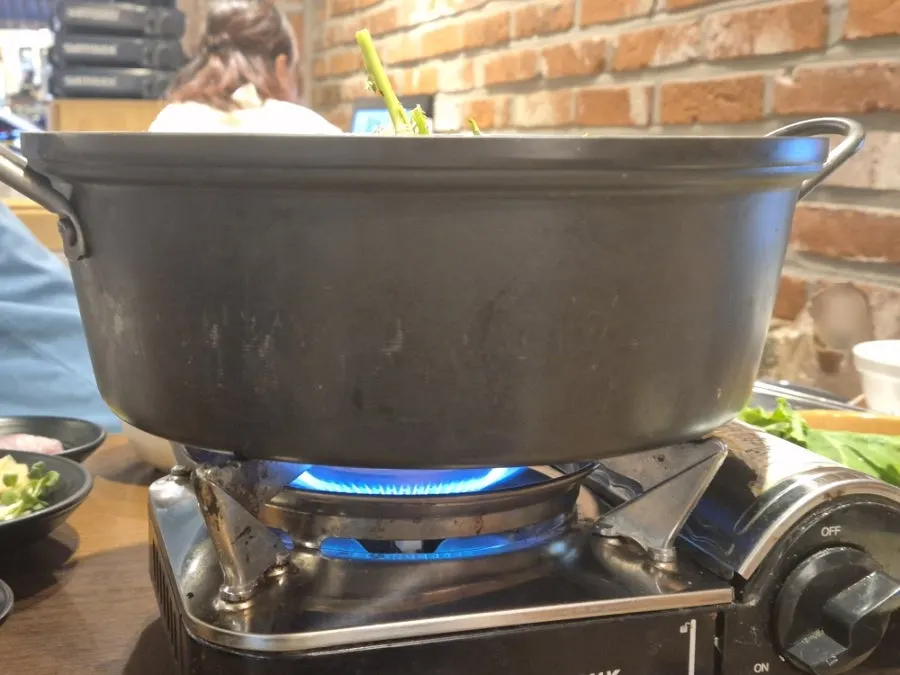 Spicy stew bubbling in a deep pot