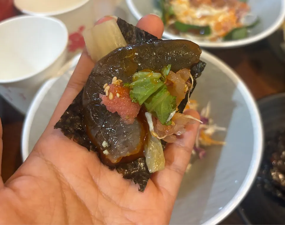 Two shrimp prepared as raw sashimi