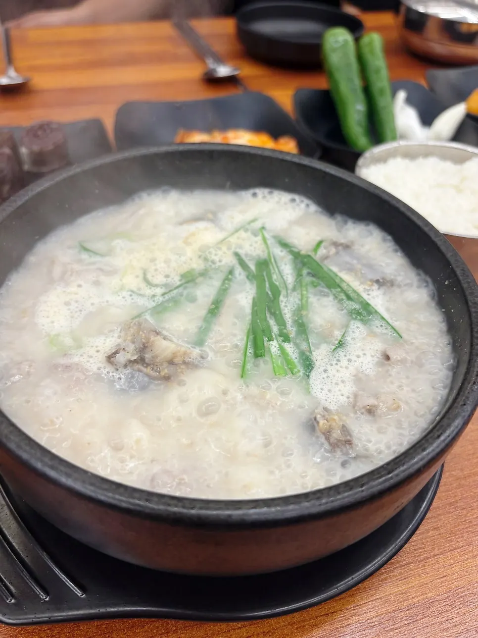 Gyeongseong sundae-guk served bubbling in a hot stone bowl
