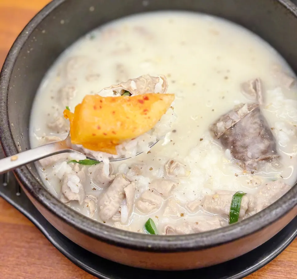 Rice mixed into the milky-white bone broth sundae-guk