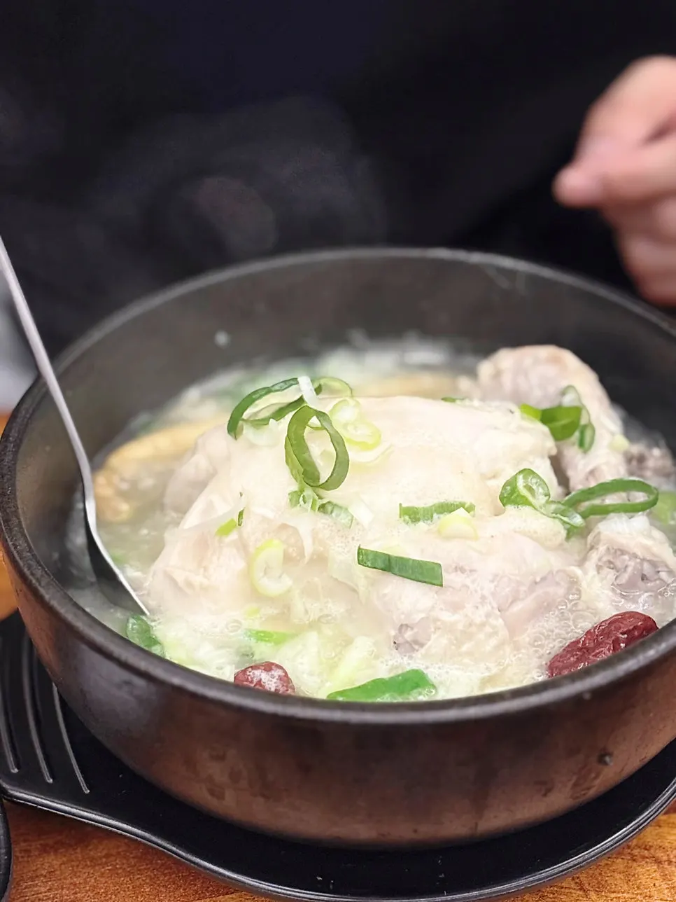 Close-up of the milky-white samgyetang broth