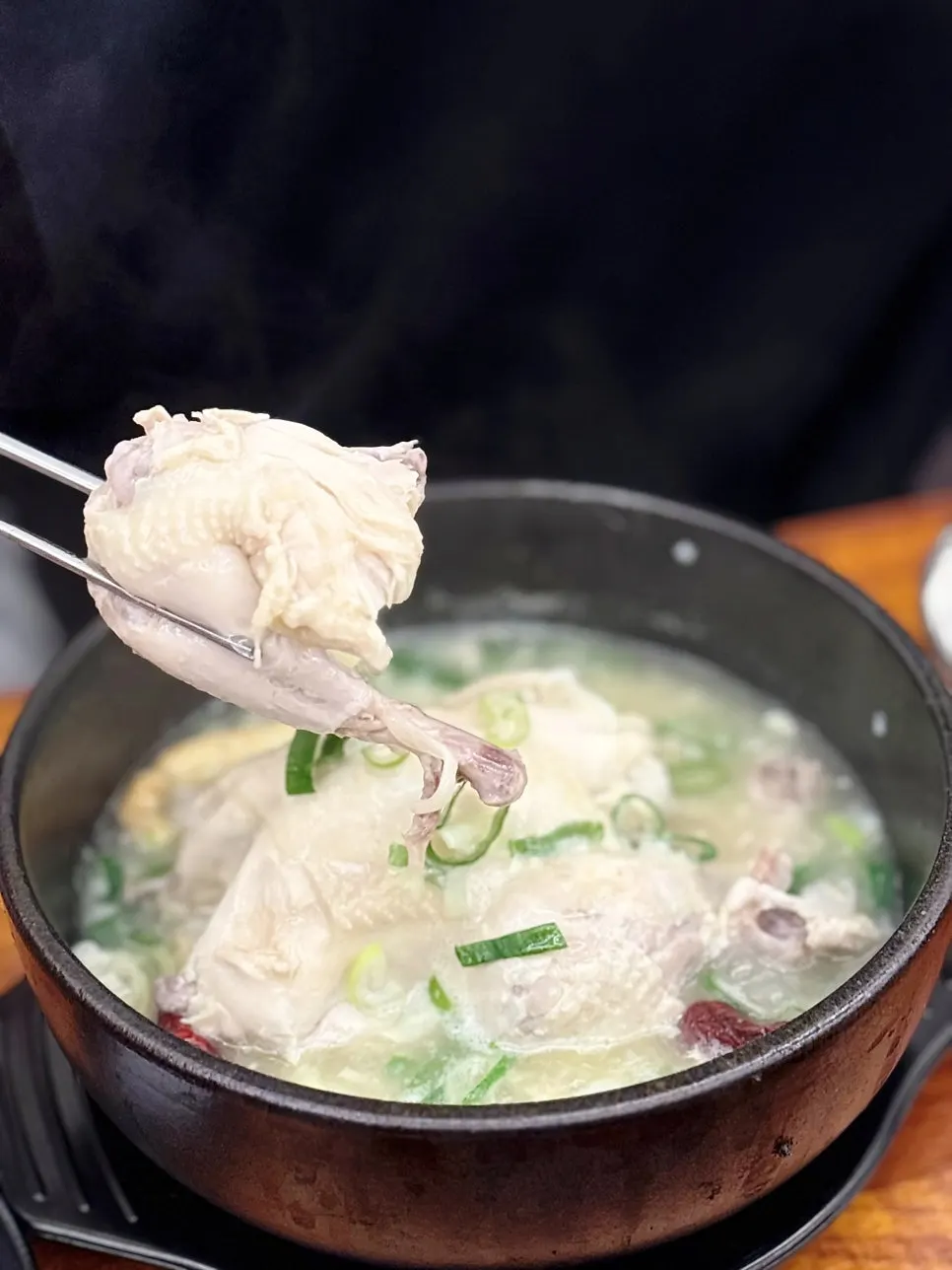 Chicken split open to reveal the stuffing inside the samgyetang