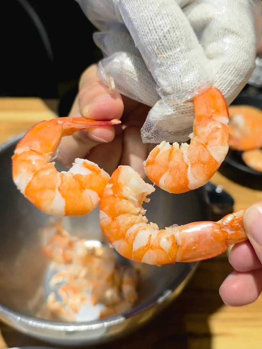 Tasting a piece of shrimp meat