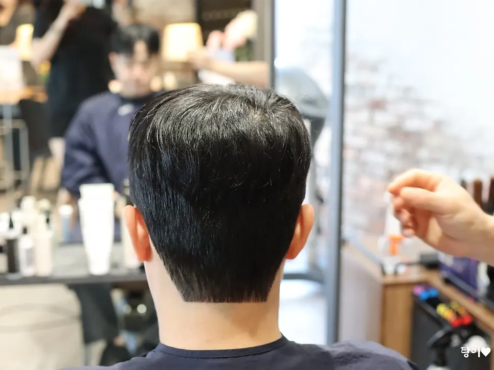 Side view of brother's hair during the down perm